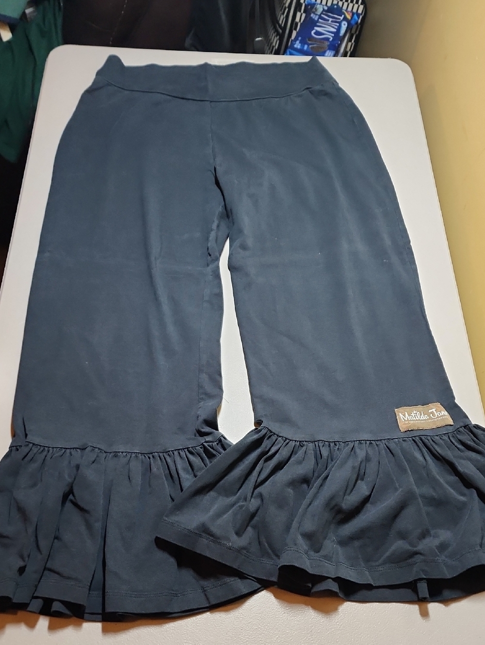 Women's Matilda Jane Black Ruffle Hem Capri Pants with Patch Logo